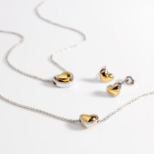 Load image into Gallery viewer, Kit Heath Heart of Gold collection flatlay — necklace, bracelet and stud earrings in sterling silver and 18ct gold plate two-tone finish, styled on white background