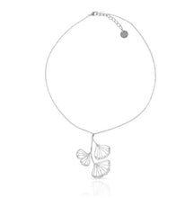 Load image into Gallery viewer, RAS Ginkgo Biloba silver plated pendant necklace and matching drop earrings displayed on white gift box with teal background