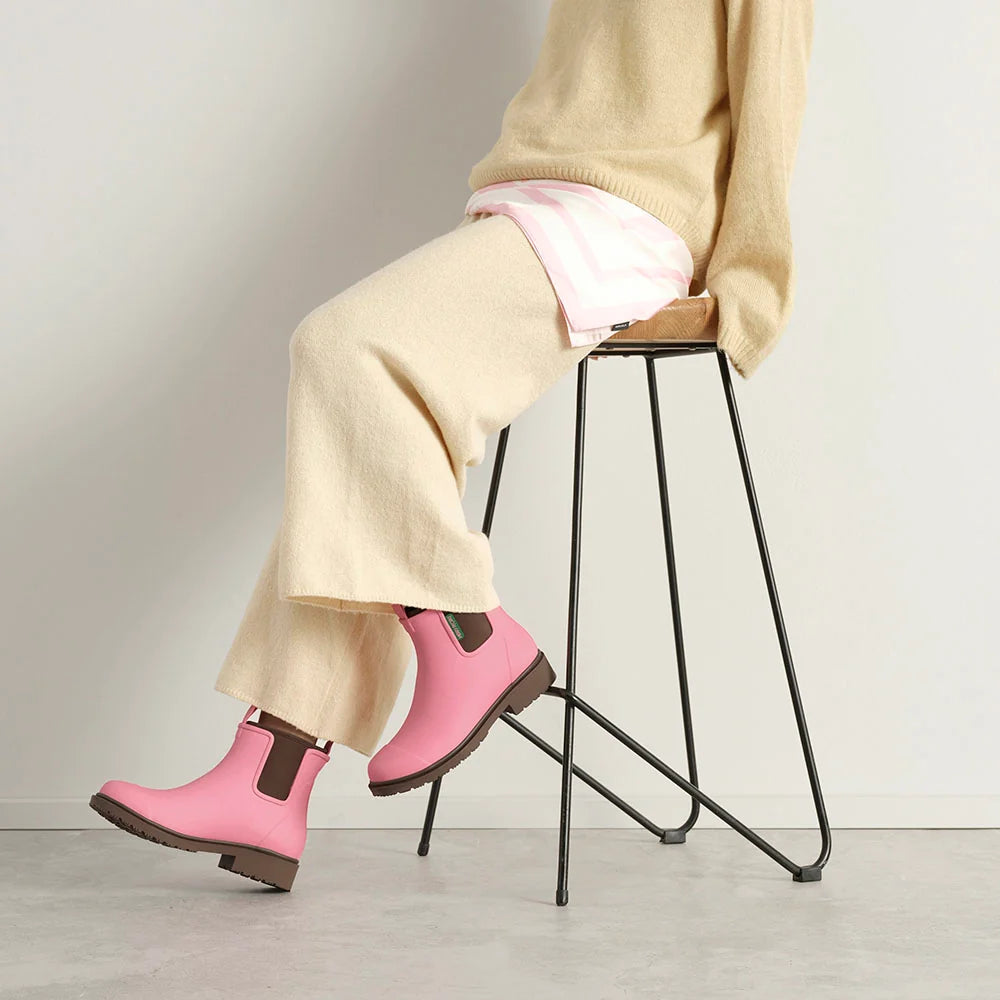 Merry People Bobbi wellington boot in Musk Pink, worn on body