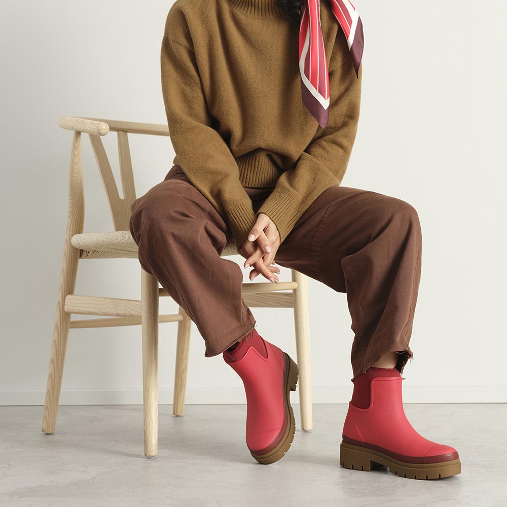 Merry People Tully wellington boot in Chilli Red, worn on body