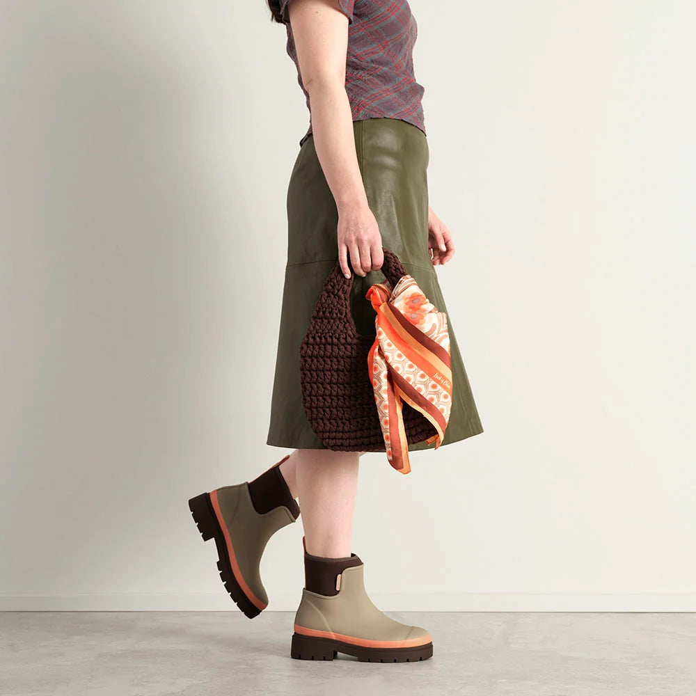 Merry People Tully wellington boot in Taupe & Apricot, worn on body