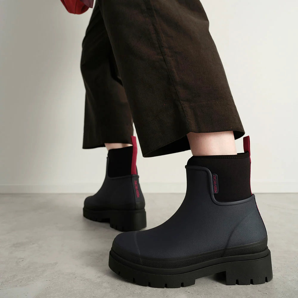 Merry People Tully wellington boot in Midnight, worn on body