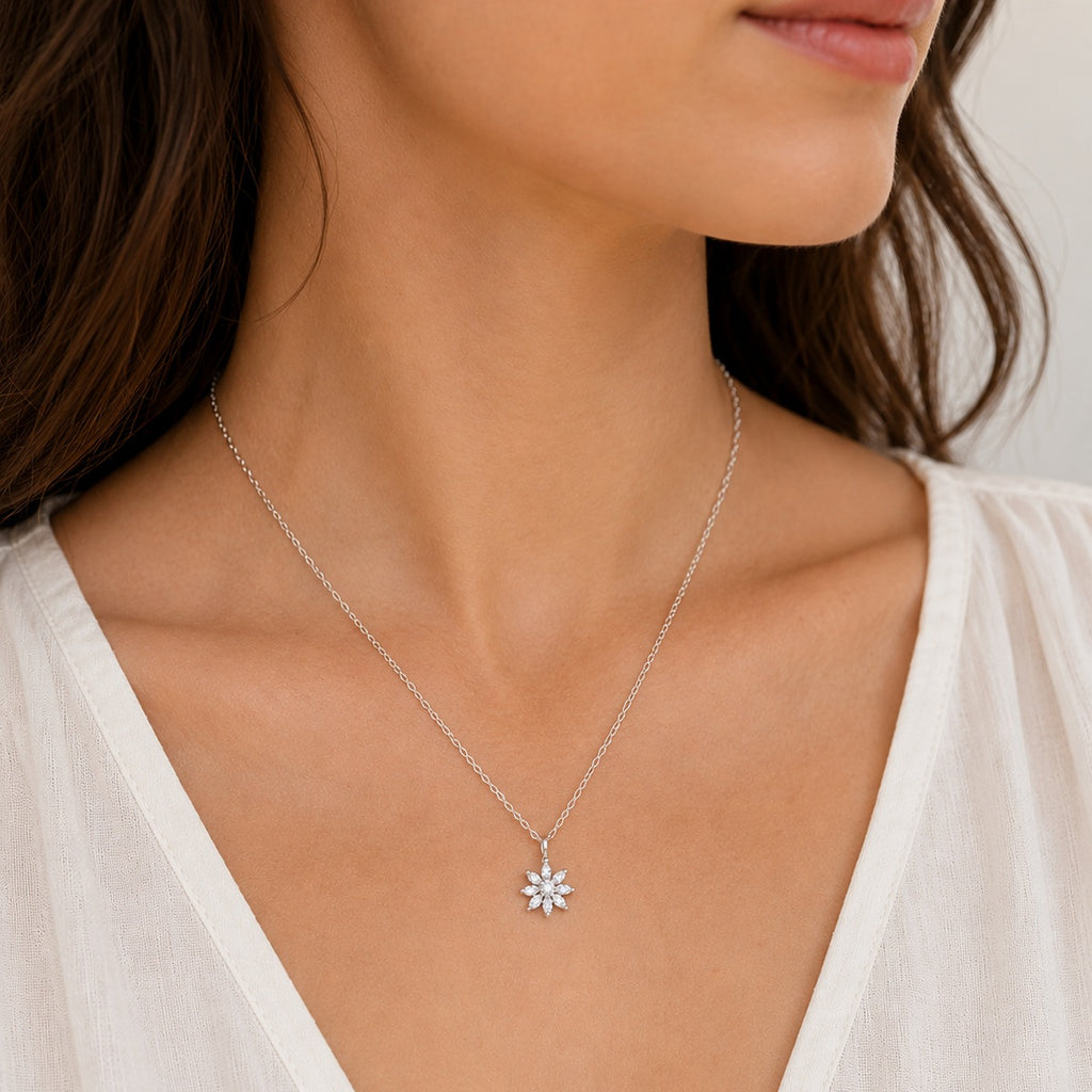Woman wearing a delicate sterling silver cubic zirconia flower necklace