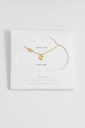 Estella Bartlett Heart Charm With Open CZ Heart Necklace in gold plate, laid flat showing the off-centre heart charm with CZ detailing