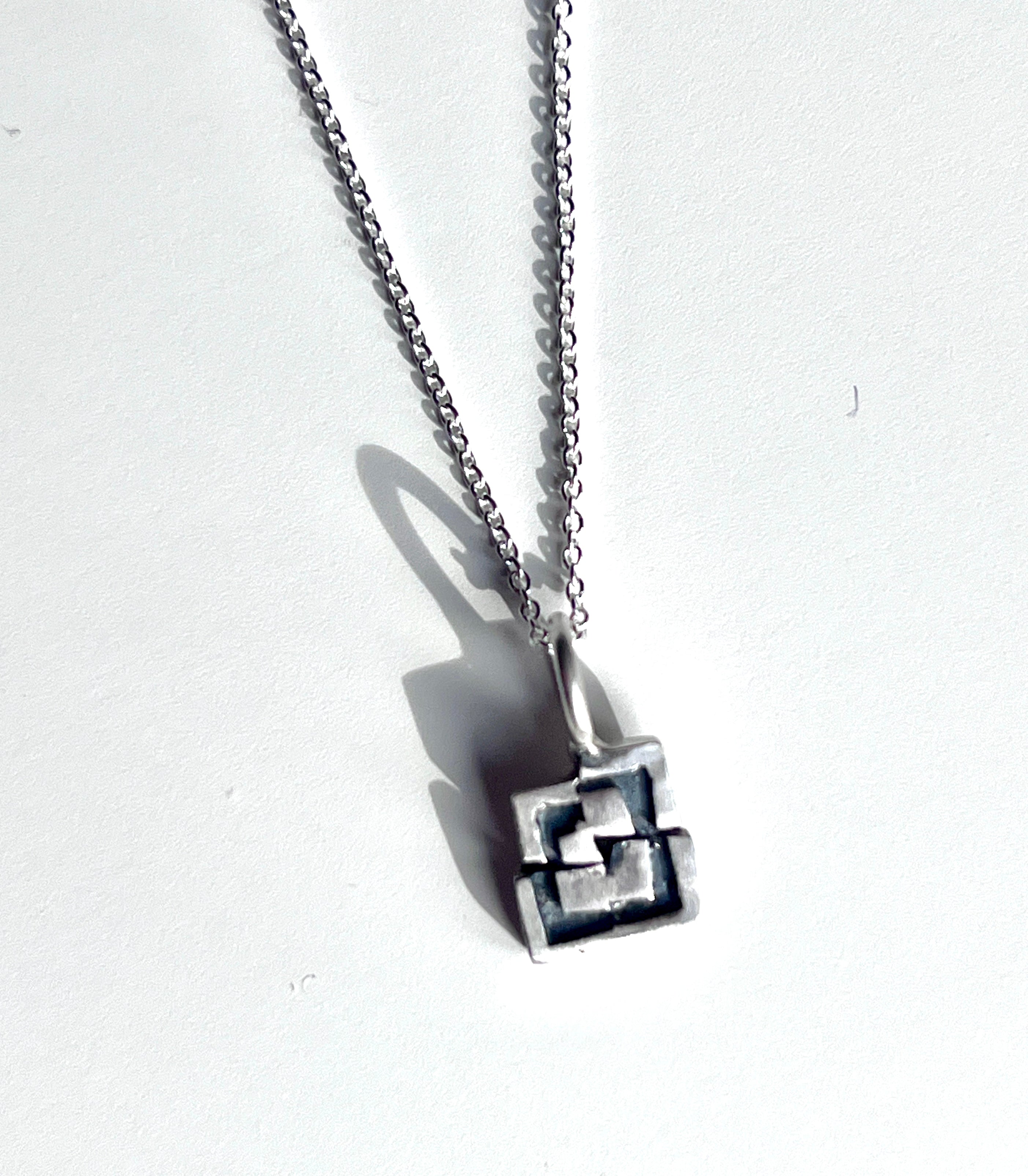 Handmade geometric sterling silver pendant by Adele Taylor Sheffield