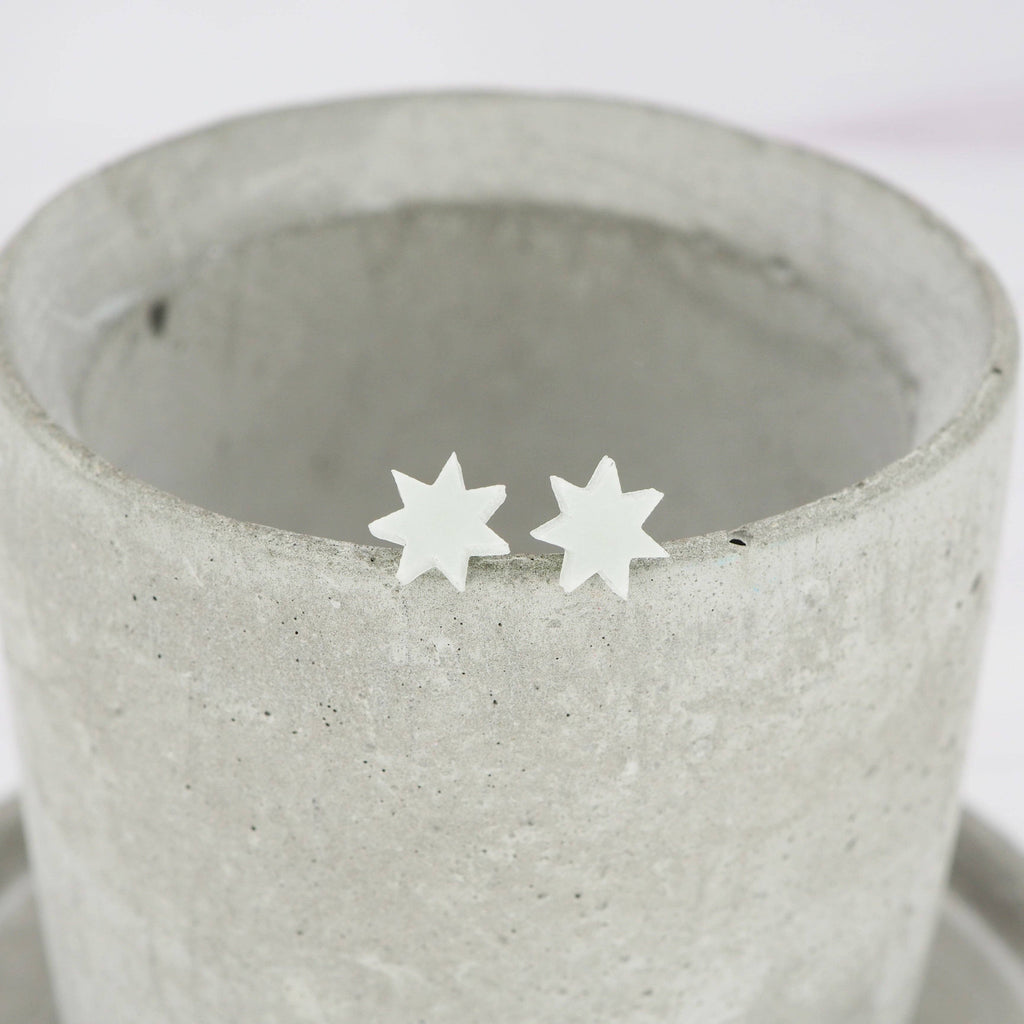 Glow in the dark 7 point star studs