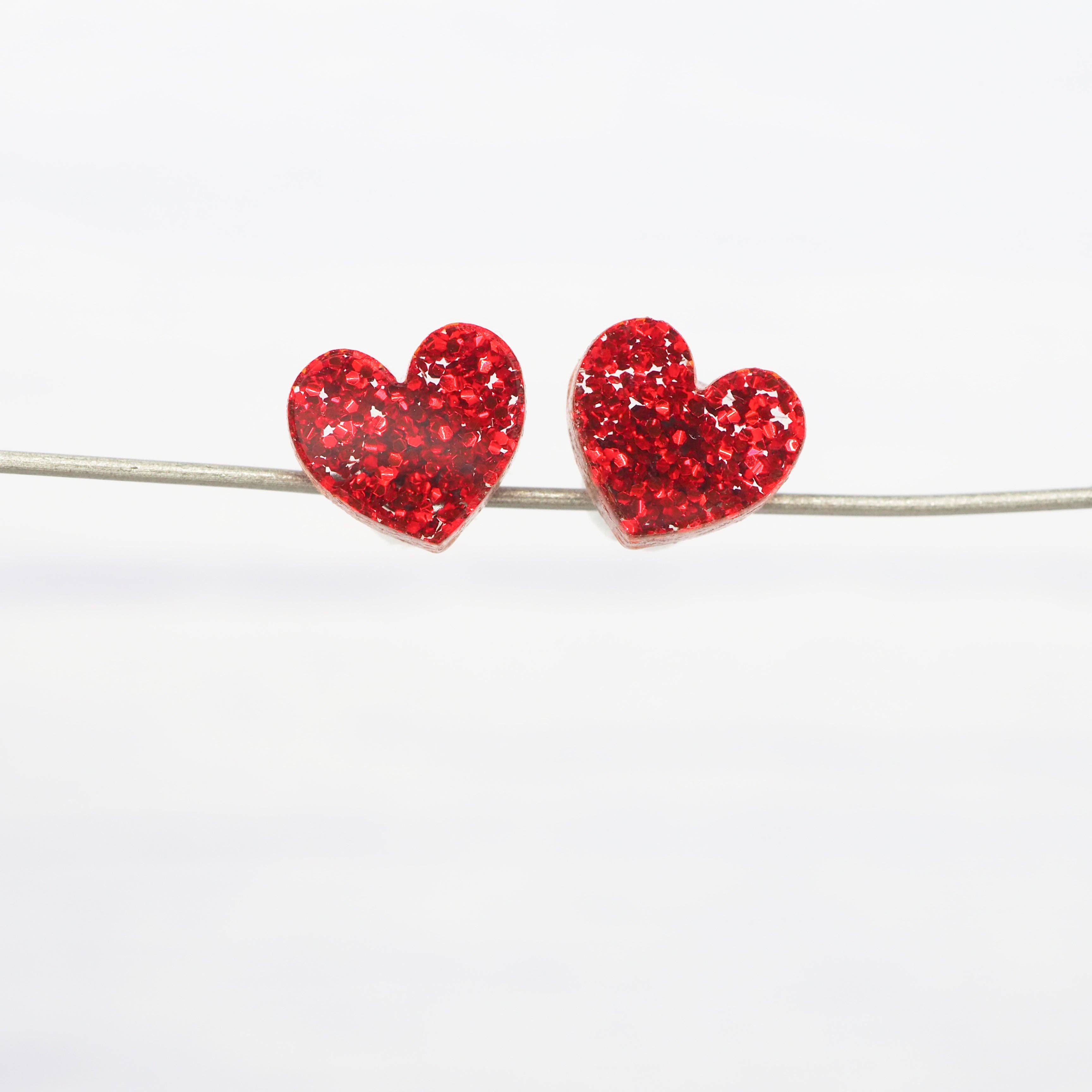 Red glitter small heart acrylic studs