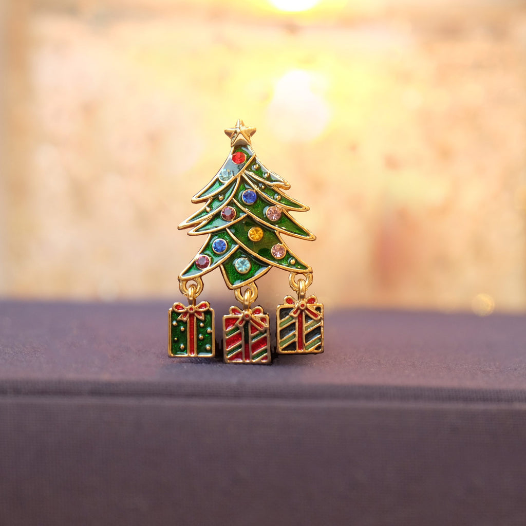 Gold Christmas tree brooch with dangly presents on book - ORA Gallery