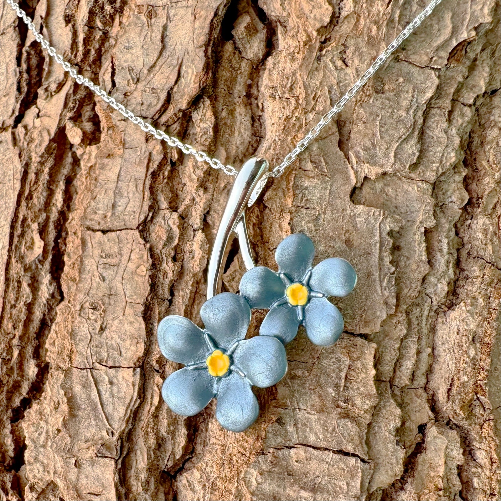 Forget me not silver pendant necklace on wood - ORA Gallery