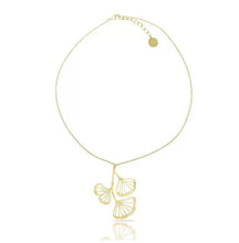 Load image into Gallery viewer, RAS Ginkgo Biloba gold plated pendant necklace and matching drop earrings displayed on white gift box with teal background
