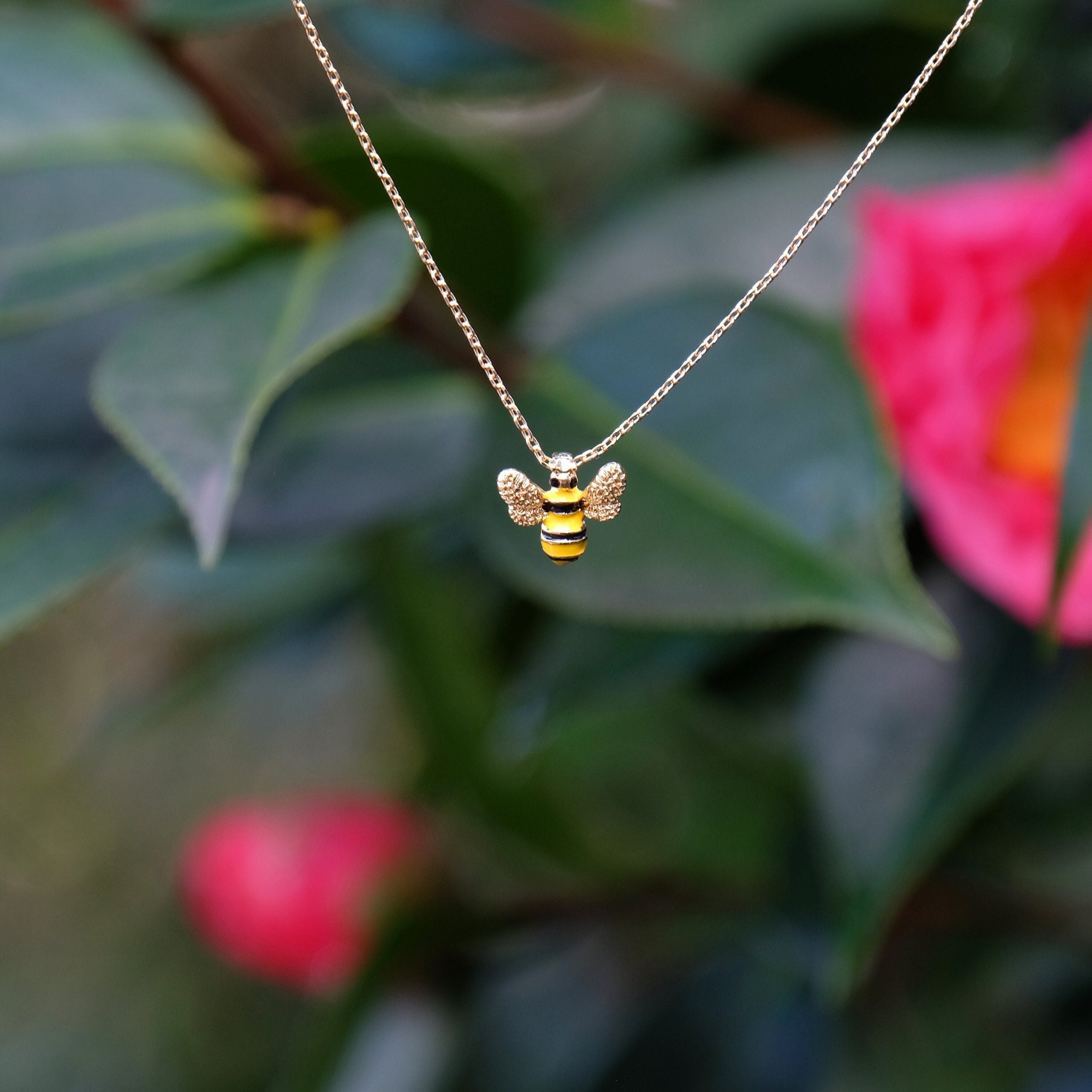 Gold bee pendant necklace close up - ORA Gallery