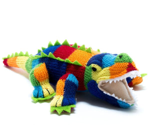 Knitted striped crocodile toy